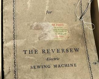 Vintage REVERSEW Electric Sewing Machine with Original Manual. Comes compete with wooden sewing table and some accessories.  