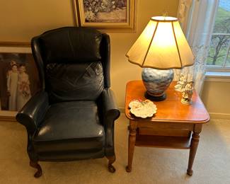 Preliminary walkthrough photo: 

Dark blue leather wingback chair! Great condition and uber comfortable! Side table with one of the many lamps in the house! 