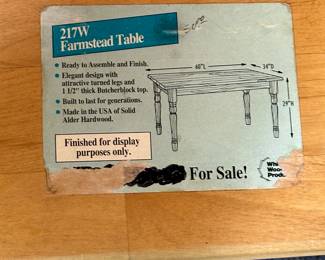 This is a terrific blond oak Farmstead Table! This table was a display piece from a furniture store. The tag tells the full story! Is in excellent condition. 