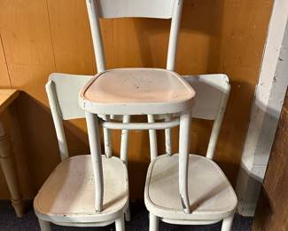 The wooden cafe chairs. Painted white. Nice and sturdy! 
