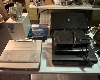 A table full of whatnots and some small electronics! 