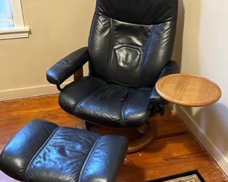 Preliminary walkthrough photo: 

One of a pair of Leather chairs with ottoman and side table! Very cool! 