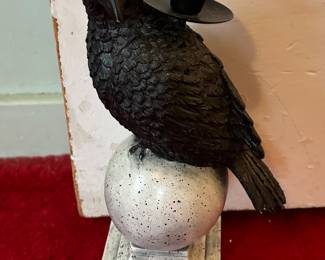 Preliminary walkthrough photo: 

Interesting black crow candle holder, currently being used as a door stop!?