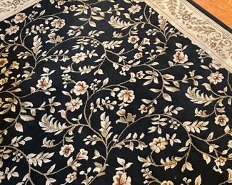 Preliminary walkthrough photo: 

This is just one example of the many rugs found throughout the house. All in very good with little wear. 