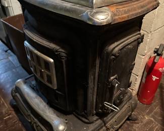 An awesome Vintage J.C. Penny Wood Burning Parlor Stove - Retail: 871-7780 - Catalogue: 901-6858! This piece is in VERY nice condition! It comes with the original installation manual. Please note: Due to our insurance coverage,  if you intend on/or purchasing this wood burning stove, you MUST bring tools to disassemble yourself, and a crew to move it. 