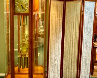 A truly stunning and unique Howard Miller lighted clock/curio cabinet!!!