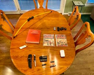 Very solid dining room table with two leaves, pads, and six chairs • Archie Comic Books • Pocket Knives including a Buck Knife (116)