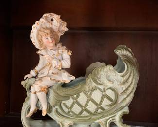 Very large old German bisque boy on a sleigh
