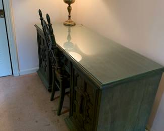 Large painted green, Mid Century Modern desk with matching cool chair. Large brass lamp with black shade.