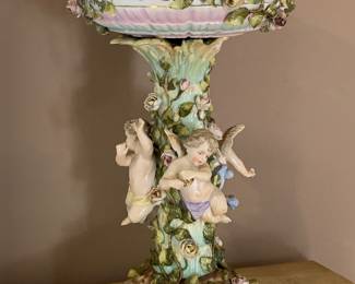 Large porcelain compote with three cherubs/putti