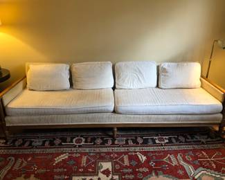 Long low vintage sofa with cane sides, 1 side as is
