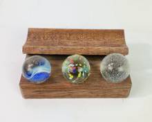 3 Vintage Glass Cats Eye, Confetti Speckle, & Clearie Shooter Marbles On Wooden Stand