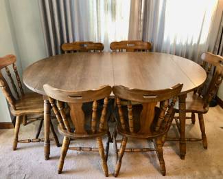 * Oval Dining Room Table w Drop Down Sides w 6 Chairs, made in Yugoslavia is 63 inches long with two leaves and 41 inches wide and 29 inches tall when Full Size. Small Rectangle when no leaves , sides dropped down. $150.        
