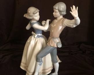 #5 Lladro ‘Dancing The Polka’ Porcelain Figurine. #5252. Mint Condition, Comes with Box.  This collectible figurine was originally designed by Regino Torrijos in 1984, retired 1994. Measures 12 ¼ T X 9 ½ W $200