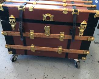 Steam trunk refurbished inside and out with casters for easy moving.  Casters can be removed.