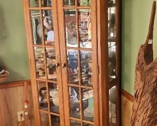 nice 6 ft lighted curio cabinet with glass shelves