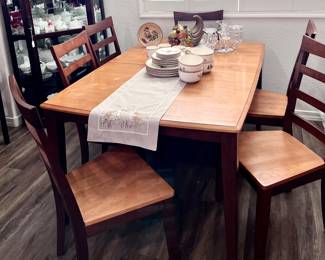 Beautiful rectangular wood dining table with 6 chairs and hidden leaf
