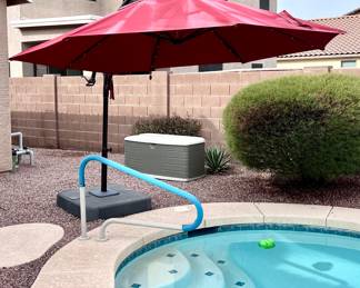 Large poolside umbrella with lights