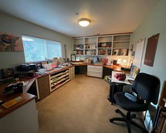 Office full of art books, art supplies, misc