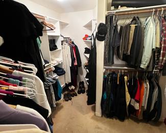 closet full of womens clothing mostly, some mens, snow boots, gloves, beanies and hats