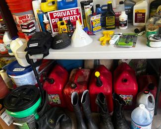 Fluids for cars and John Deere, gasoline cans, grease, funnels, rain boots 