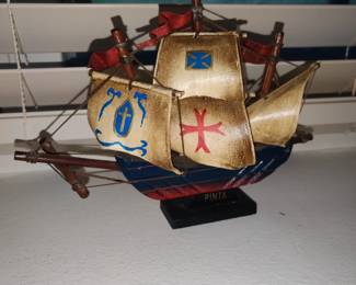 The largest ship is approximately 12" tall with the other two stepping down in size...