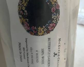 McKenzie-Child’s 6’ round area rug.  Never opened.  Zoom in to see pattern.
$650