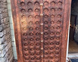 Indian teak and brass armoire storage with shelves (note: damage top right) measures 6.7' x 3.6' x 27" D  $400.