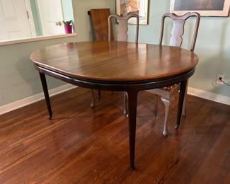 Landstrom (Rockford, Ill.) vintage hybrid MCM / Hollywood regency round dining table with two leaves on casters, shown here with single leaf inserted.