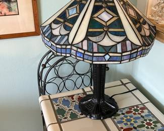 Reproduction Tiffany double pull lamp on a vintage mosaic tile top table with wrought iron base 