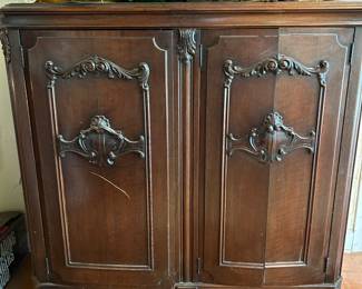 former Victrola cabinet used as storage