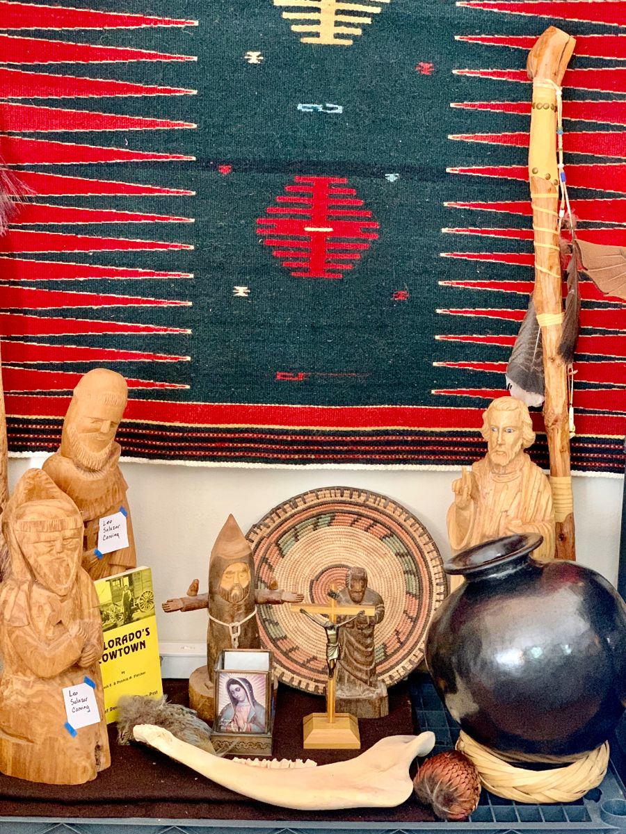 Leo Salazar Carvings. Large natural colors weaved Indian Rug. Santa Clara black pot. Jaw bone. Walking stick