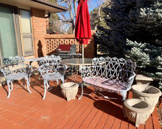 Hearts of Desire Design Cast Iron 4 piece Set. Cement planters. Glass top with umbrella patio table. Weber gas grill