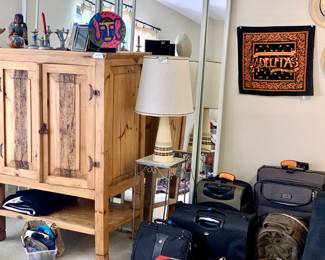 Spanish style cabinet. MCM lamps. Luggage. Tile and metal side table