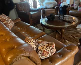 Leather couch, coffee table and Persian rug...