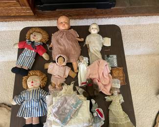A TABLE OF ANTIQUE DOLLS...