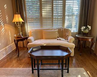 Lovely neutral curved love seat 