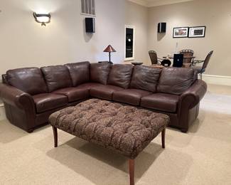 Leather L-shaped sectional  sofa and large tufted ottoman