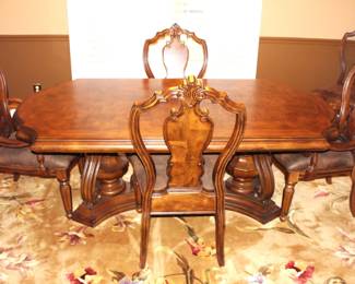 Pulaski Furniture Dining Table with six chairs.                                                            Two arm/captains' chairs plus four side chairs.                                                                 Table comes with two leaves.                                                          BUY IT NOW!   $950.00                                                                              46 1/2"w x 81 1/2 "L x 30 1/2"H