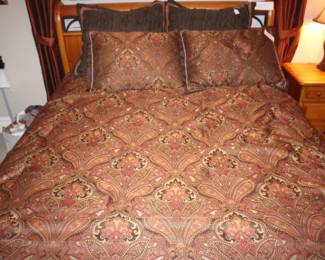 Queen size bedding and pillows.