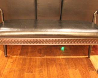 Black leather like upholstered bench.