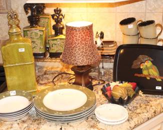 The kitchen is loaded with china, small lamps and decorative items.