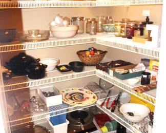 The pantry is filled with good, clean practical kitchen items.  