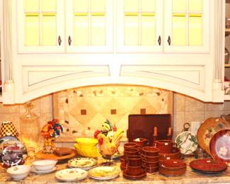 This counter is filled with Pfaltzgraff china, collector plates, decorative objects and more.  