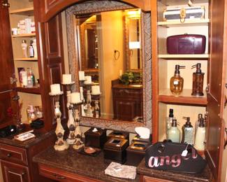 The master bedroom is full of toiletry and decorative items.  