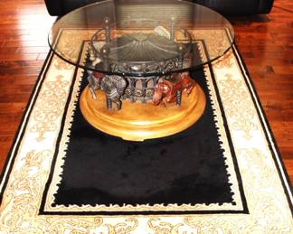 Revolving Carousel Glass Top Coffee Table.                               BUY IT NOW!      $675.00                                                                                        Glass top 44" Dia.      Base 35" Dia.