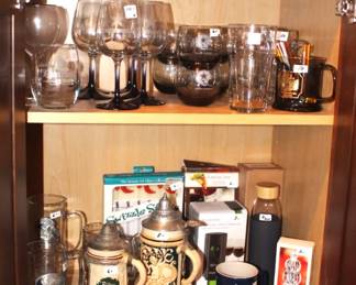 Steins, glassware and Dallas Cowboy items.