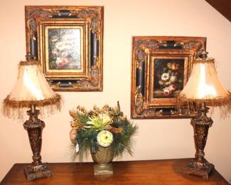 Beautifully framed oil paintings, pair of lamps and one of many silk flower arrangements.  