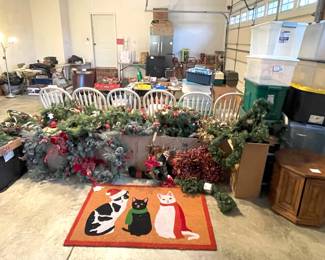 Christmas greenery, rugs, storage tubs.
