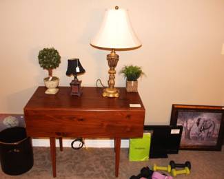Drop leaf table, crock, small TV  and weights.